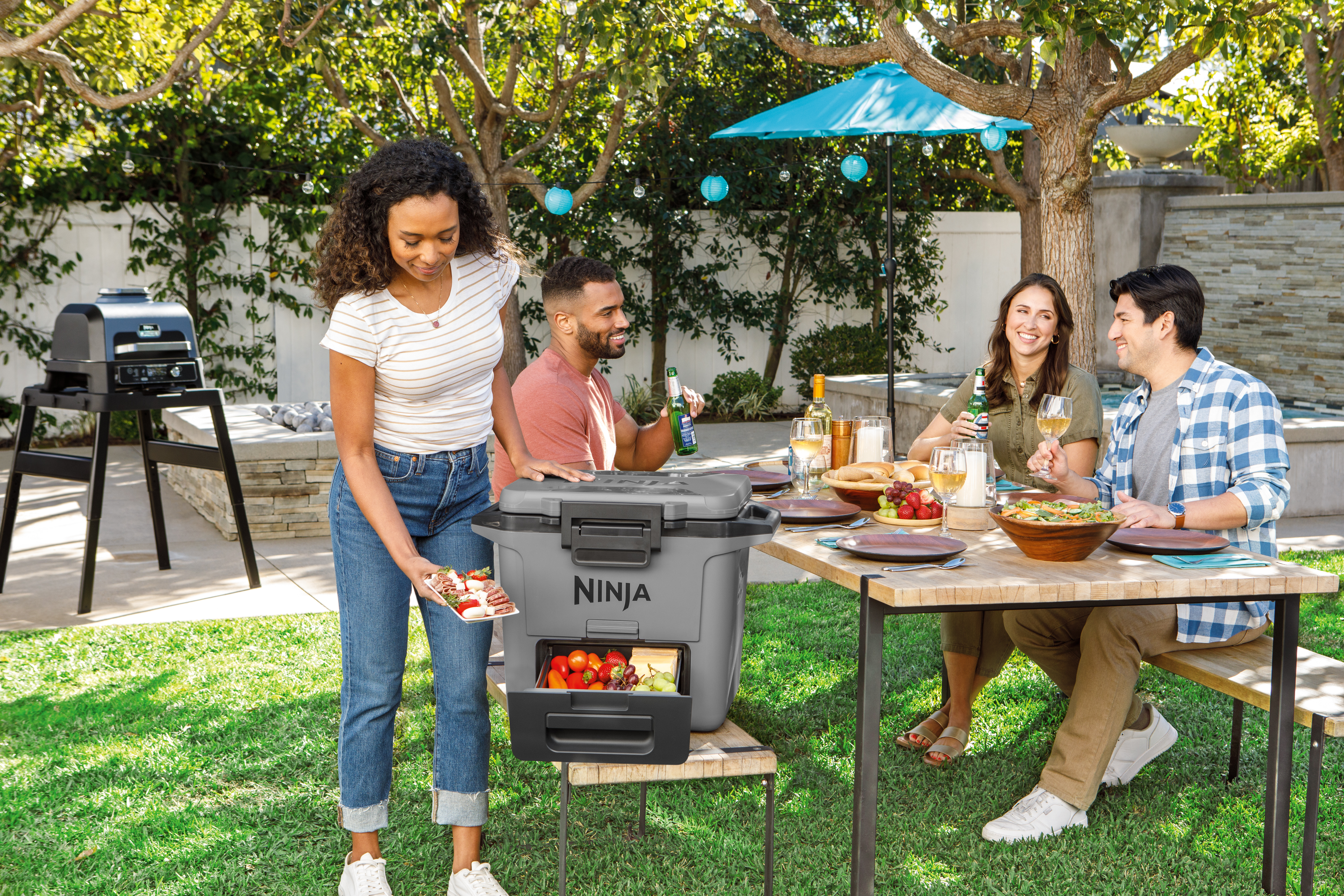 Ninja-FB131GY_InUse_BackYard_ServingFood_Group_Woman - Image 7